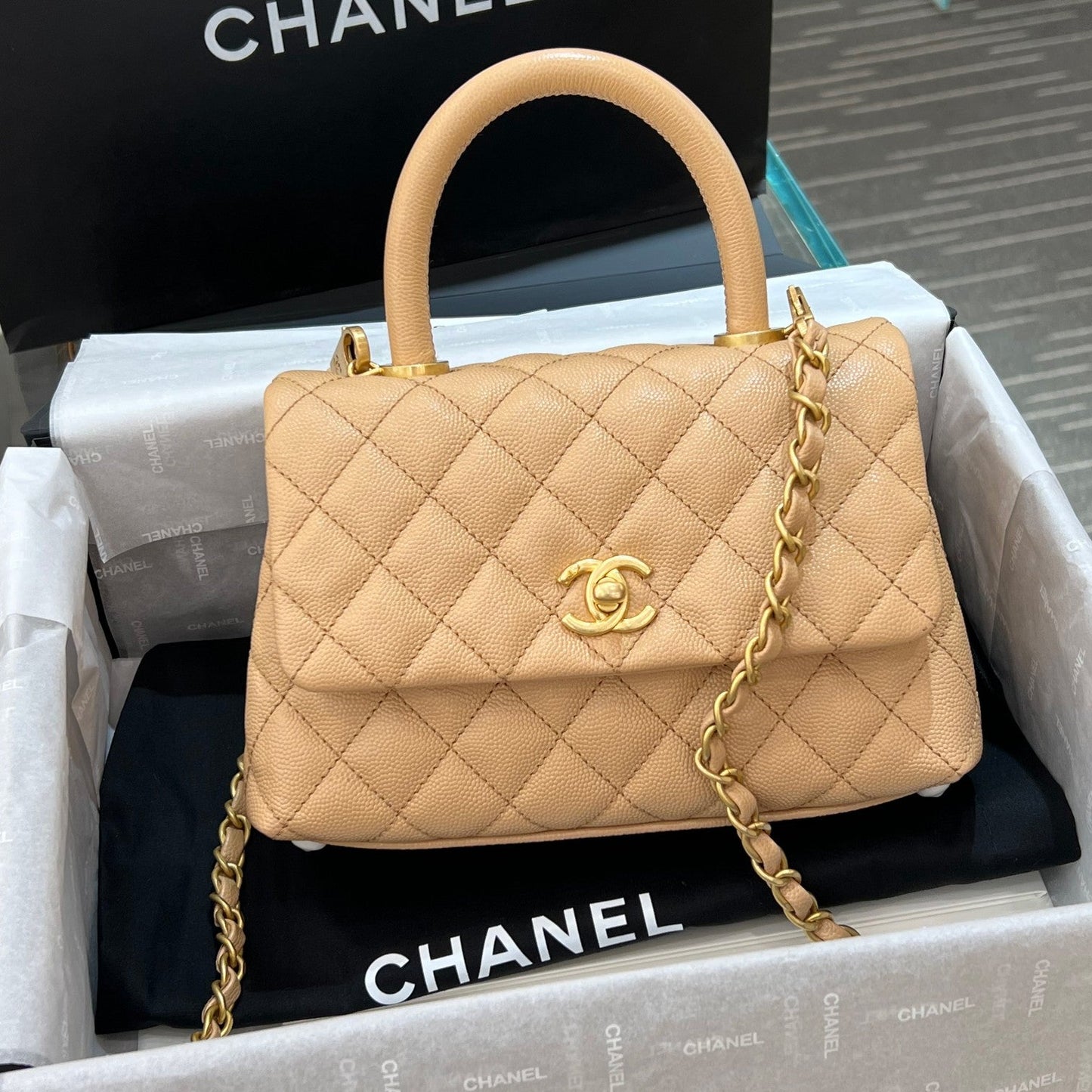 CH  FLAP BAG WITH TOP HANDLE 24  Small Grained Calfskin Light Teas